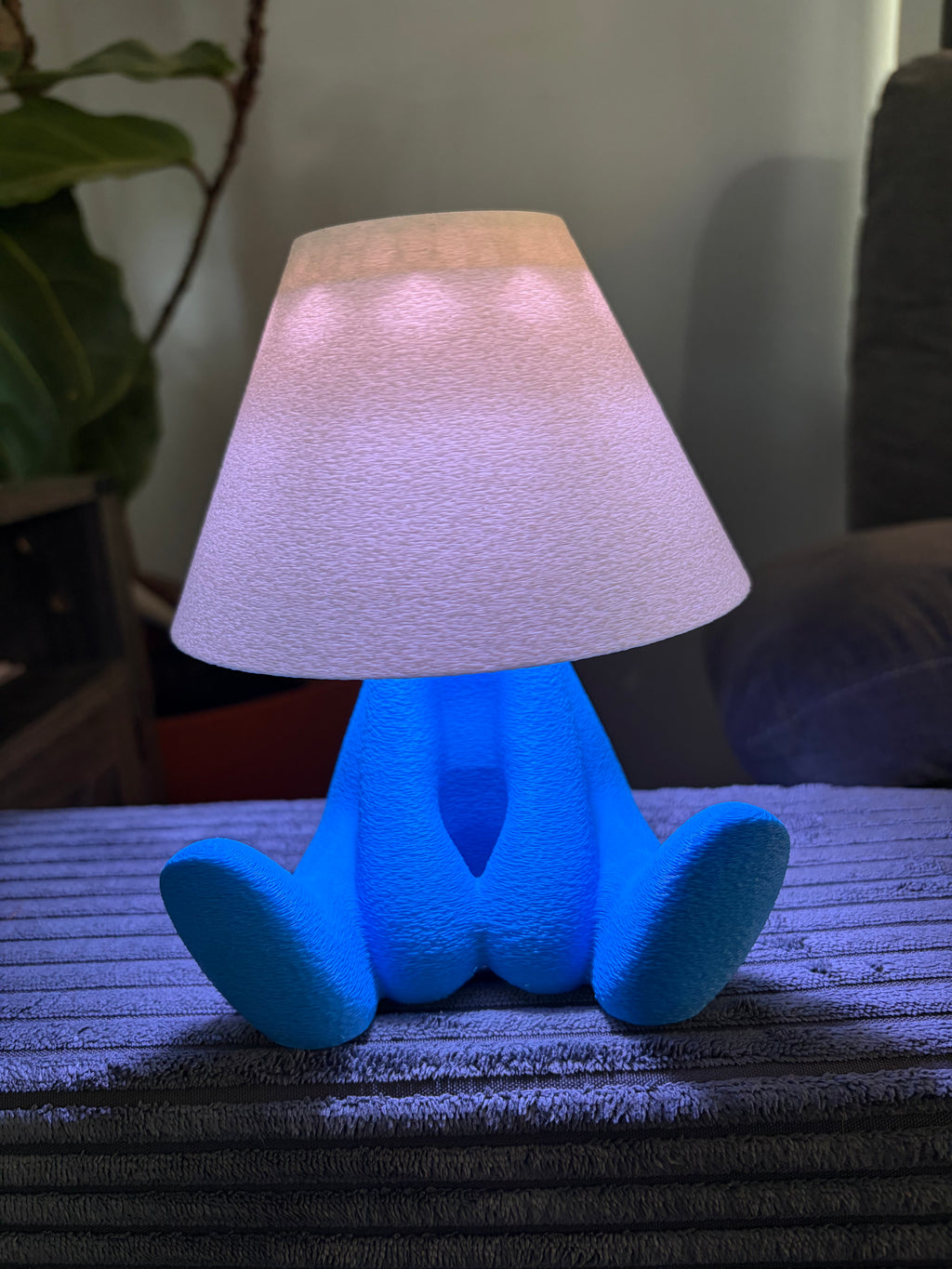 Loopy Lamp (Shy Version) featuring a cute character design illuminated in a vibrant blue ambient glow.