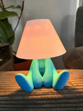 Loopy Lamp (Shy Version) featuring a cute character design illuminated in a vibrant blue ambient glow.