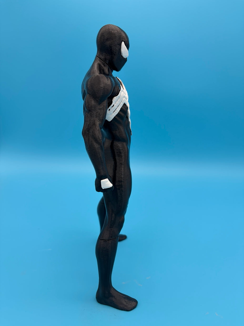 Black-suit Spider-Man figure side profile