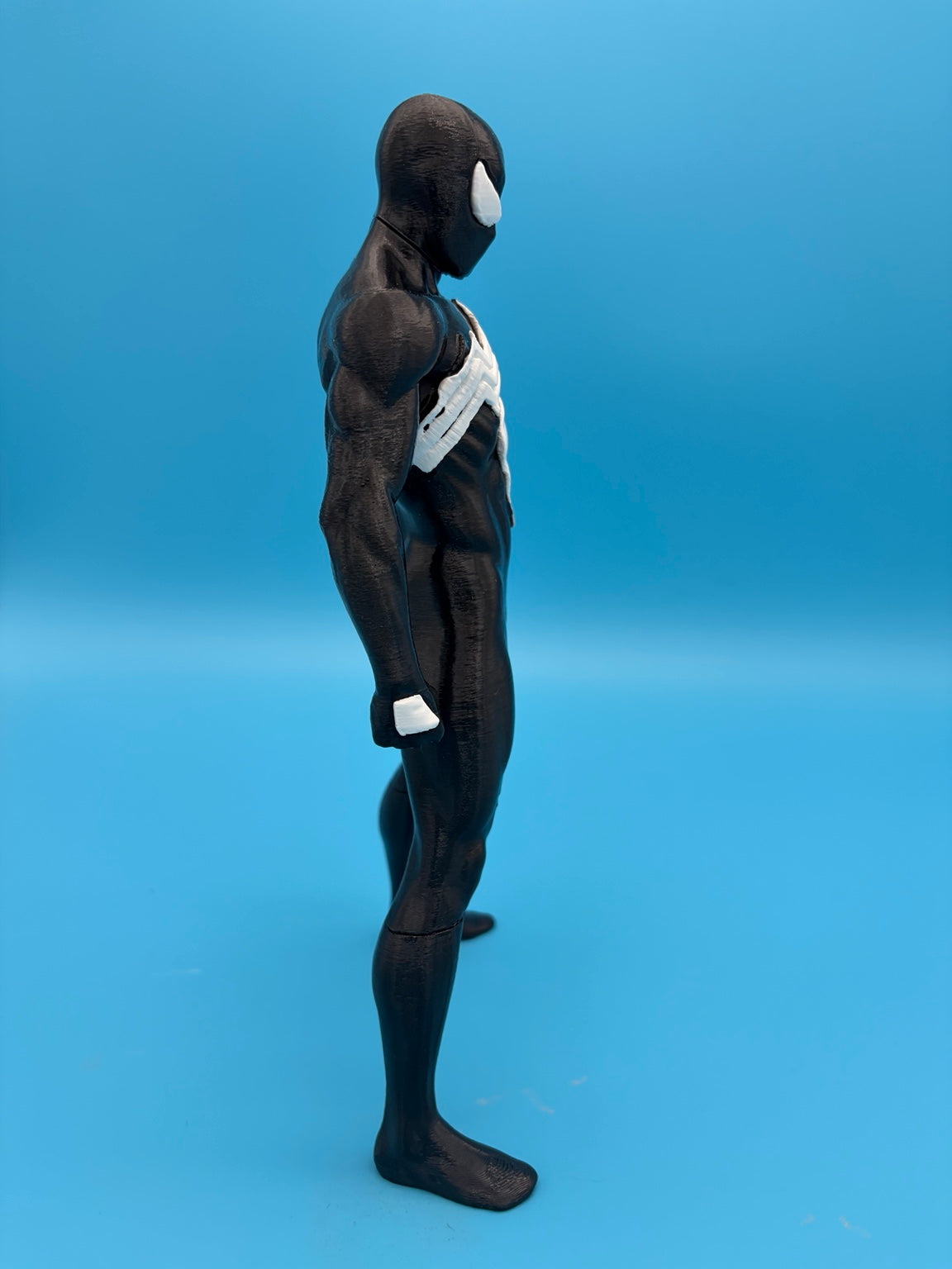 Black-suit Spider-Man figure side profile