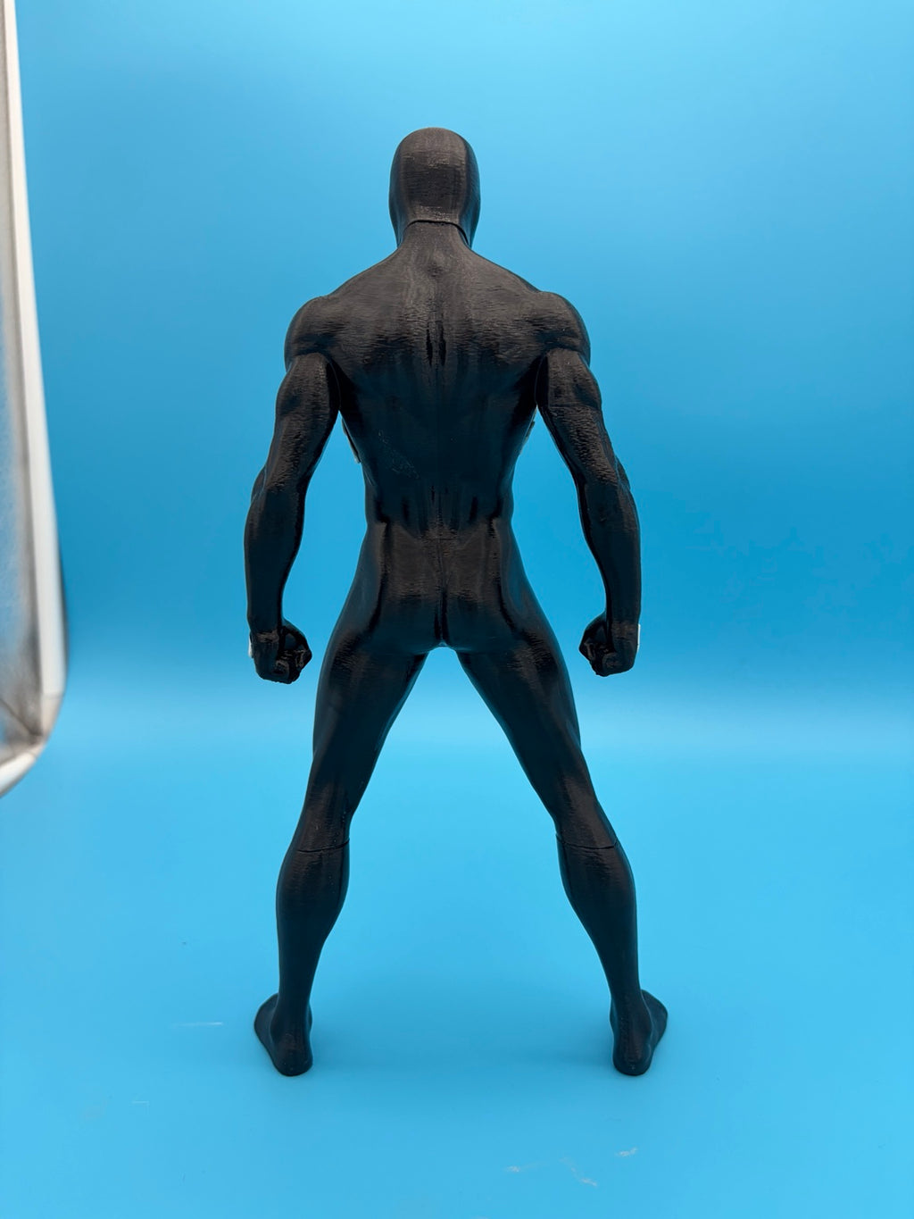 Black-suit Spider-Man figure rear view