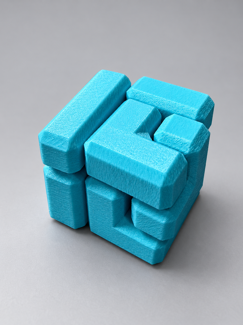 Turquoise interlocking cube puzzle fidget toy