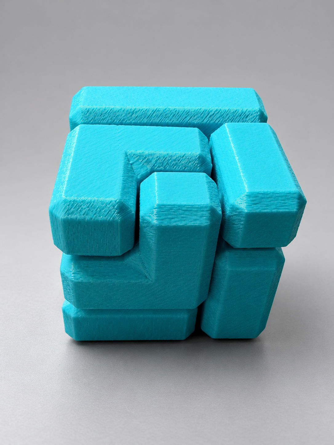 Turquoise interlocking cube puzzle fidget toy