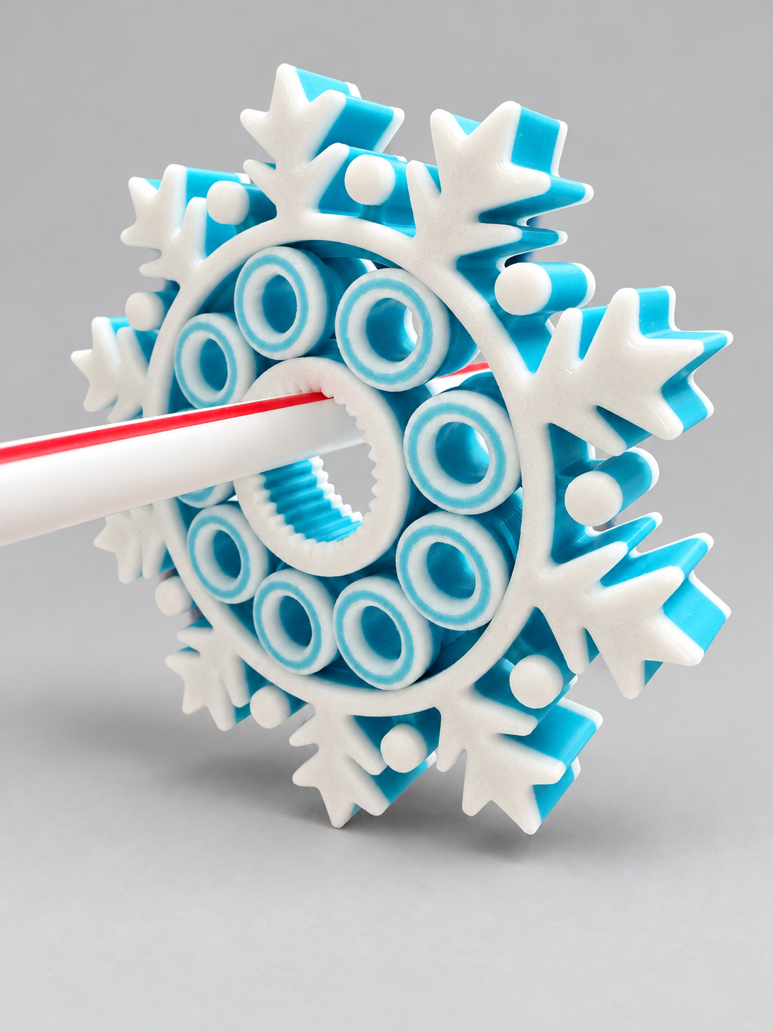 Turquoise and white snowflake fidget toy