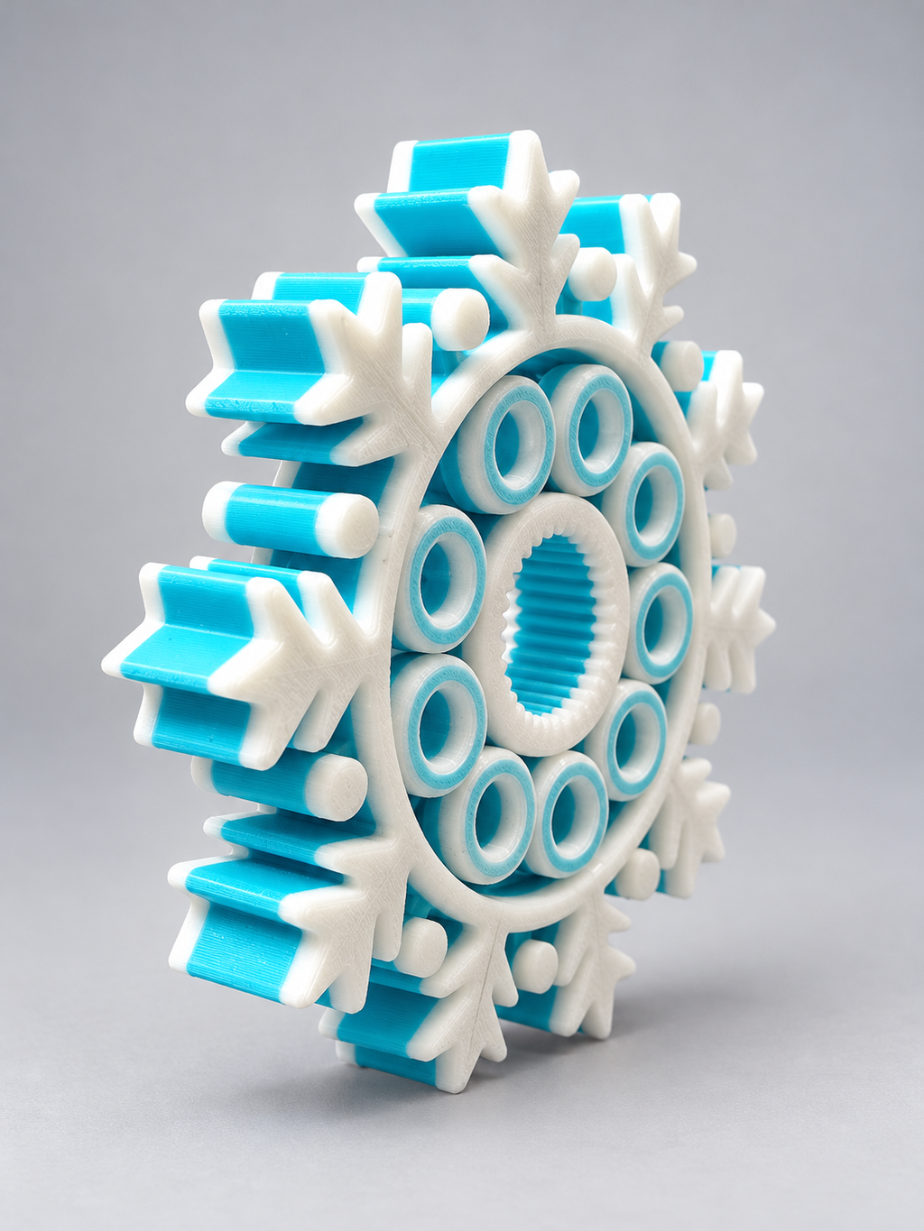 Turquoise and white snowflake fidget toy