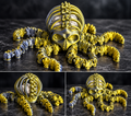 Articulated metallic gold and silver octopus skull fidget toy