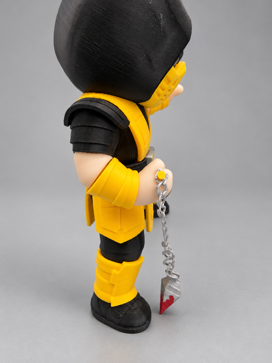Scorpion figure side view with chain