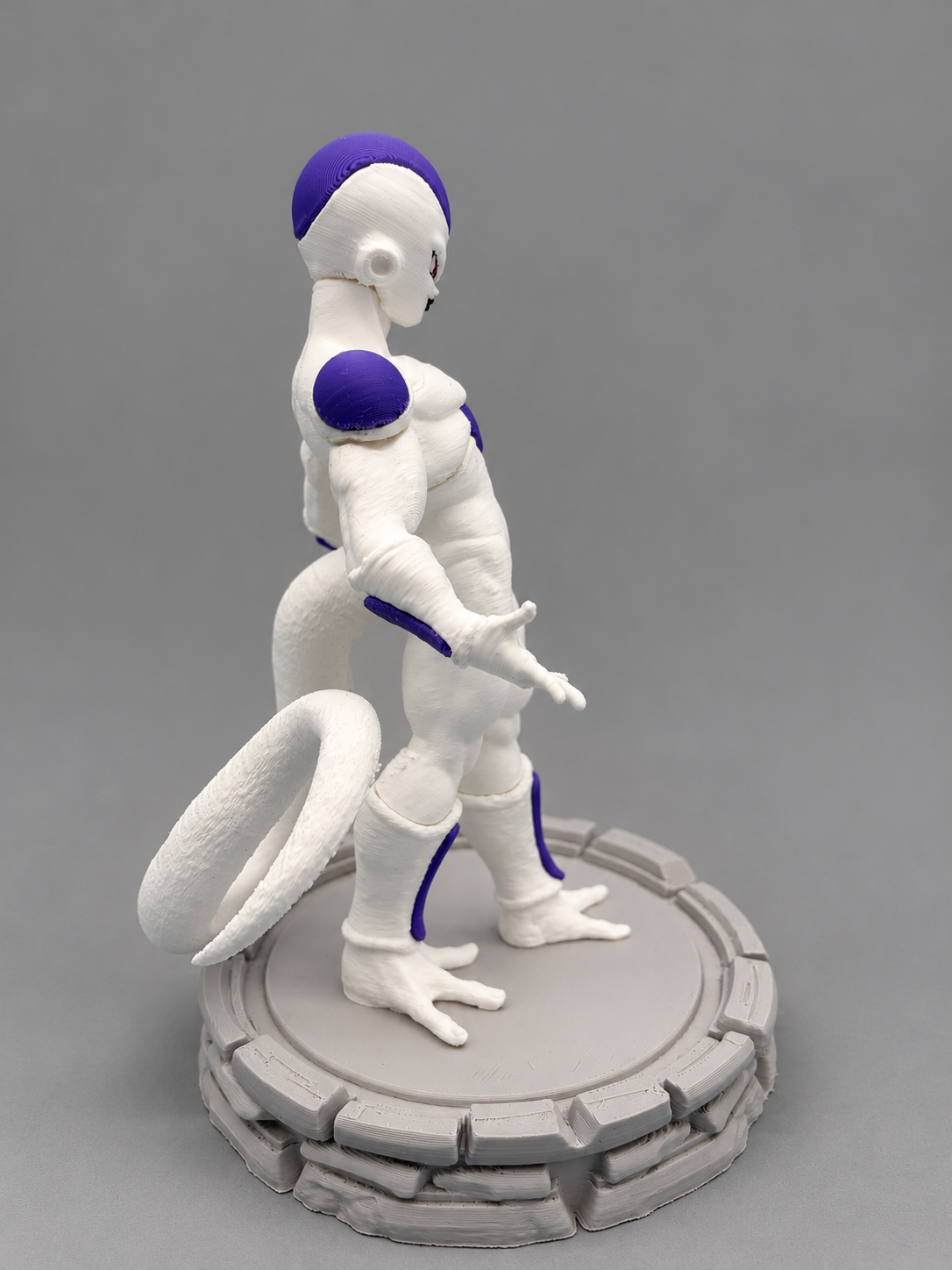 Frieza figure side view on gray base