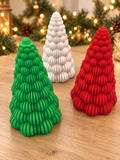 Green, white and red ribbed Christmas tree decorations in a festive setting