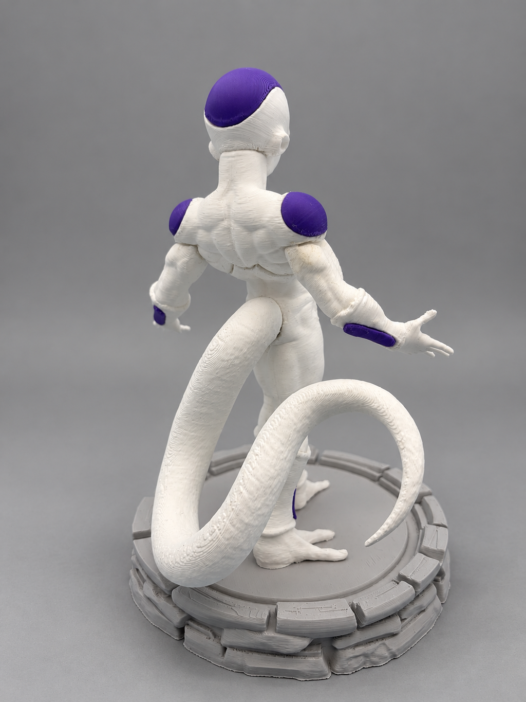 Frieza figure rear view and curled tail