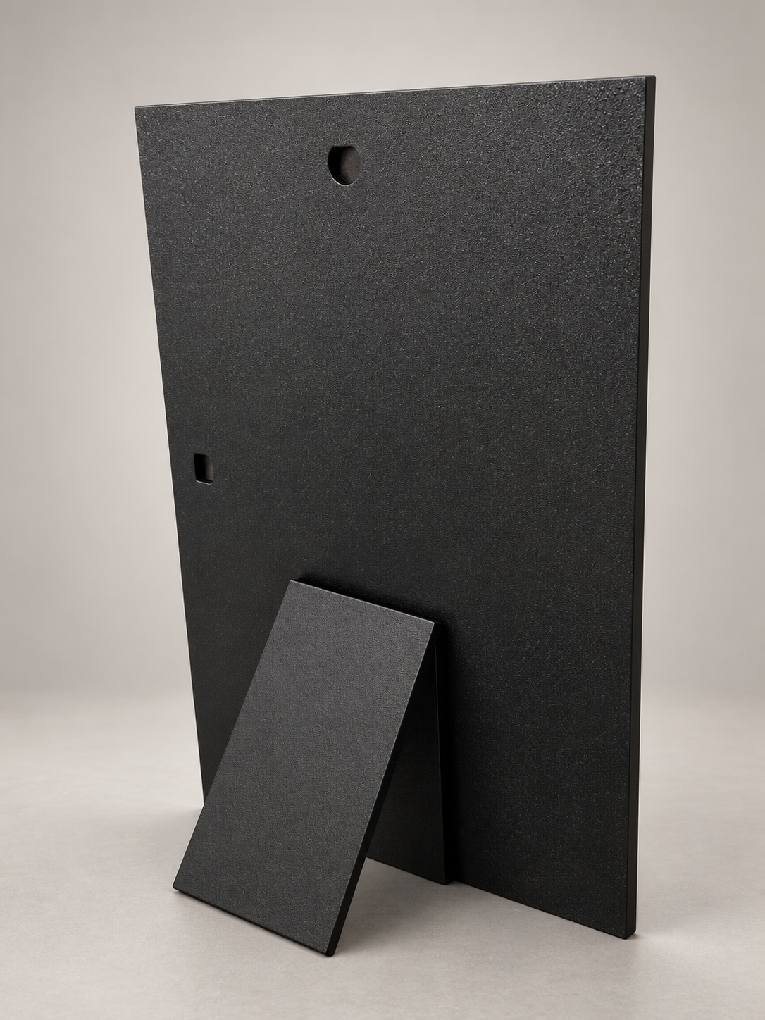 Rear view showing stand and hanging slots