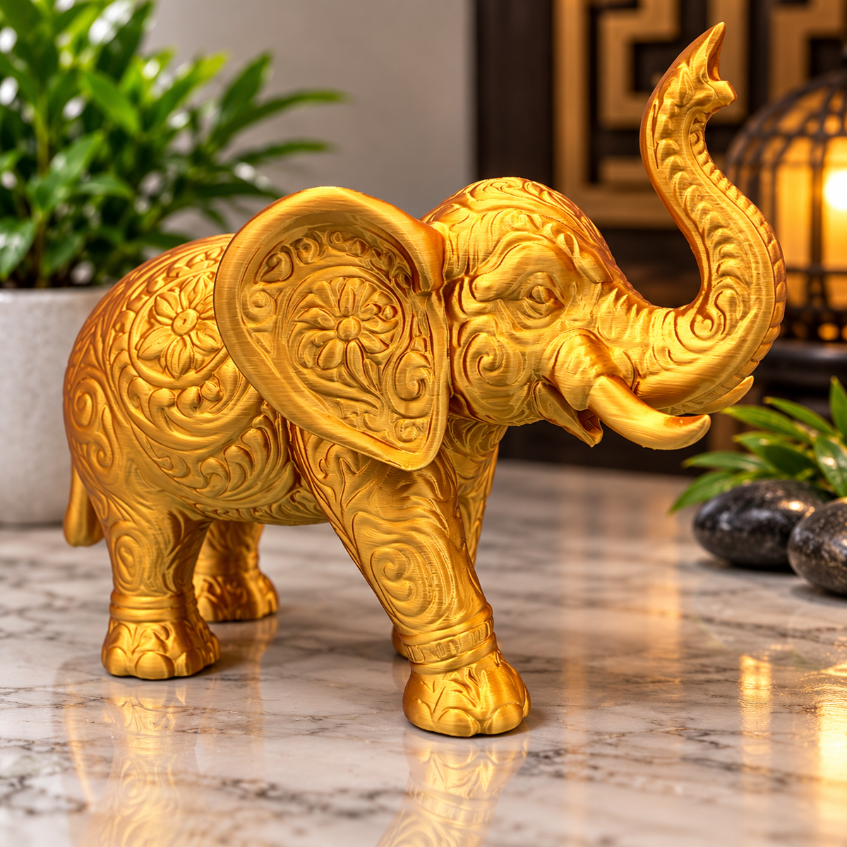 Golden lucky elephant with raised trunk and decorative carvings