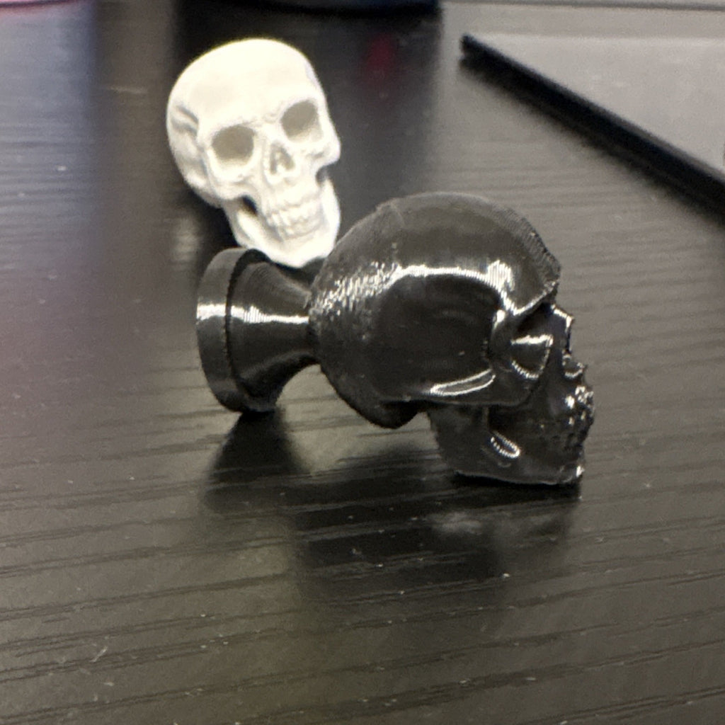 Black or light grey Skull knobs/cabinet pulls.