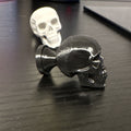 Black or light grey Skull knobs/cabinet pulls.