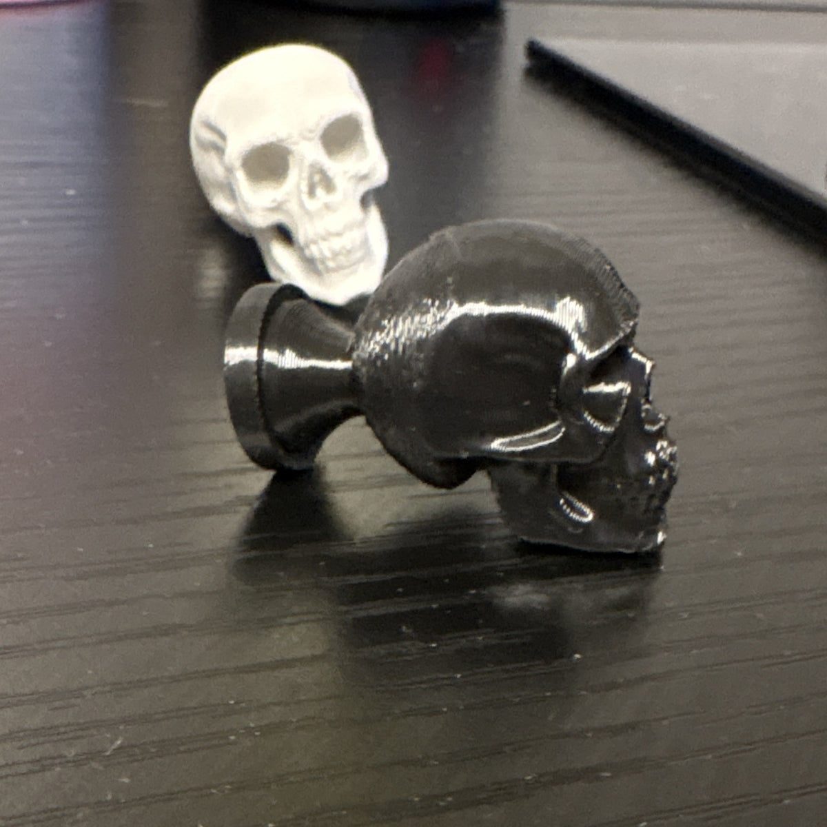 Black or light grey Skull knobs/cabinet pulls.